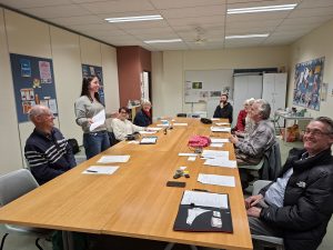 Club members listen to a member presentation.