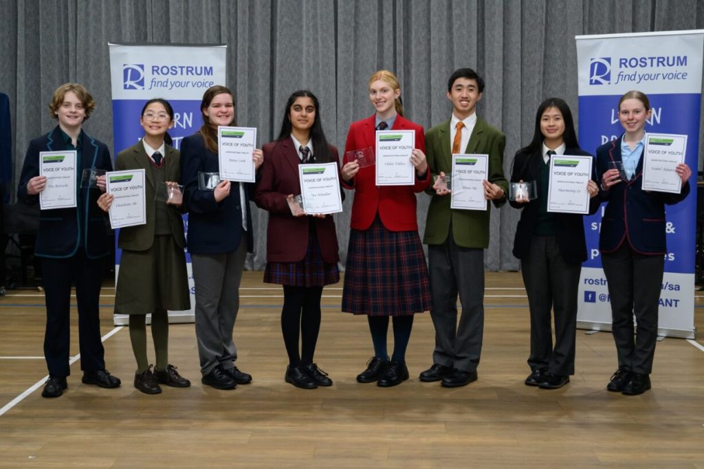2025 Rostrum Voice of Youth finalists standing on stage holding their certificates.